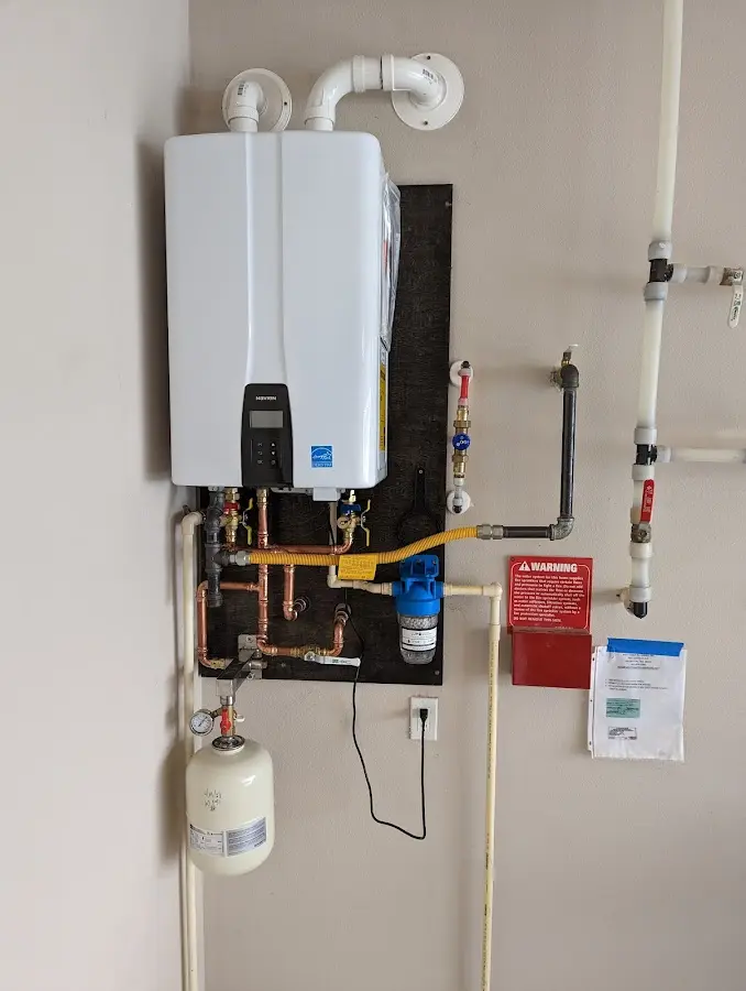 Professional plumber installing copper piping in a Crescent Springs home